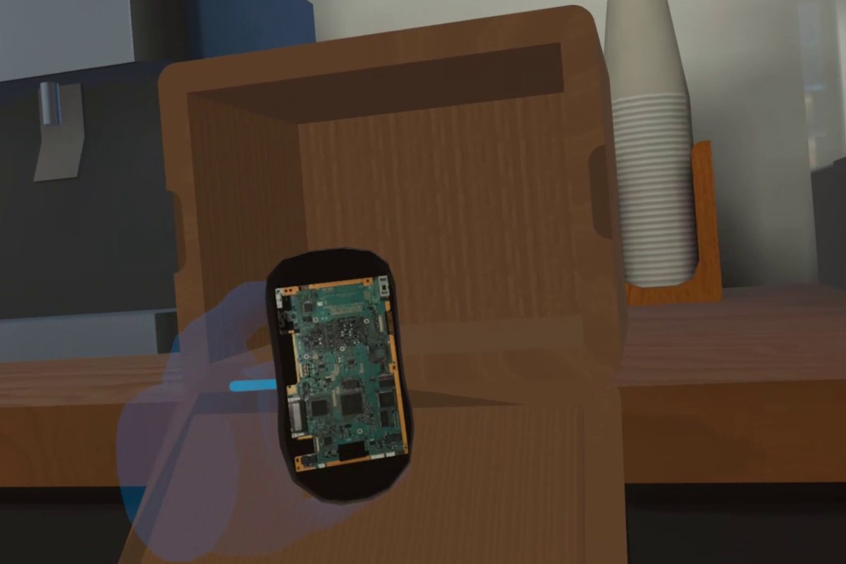 Haende in VR finden ein verstecktes Geraet unter einem Schreibtisch